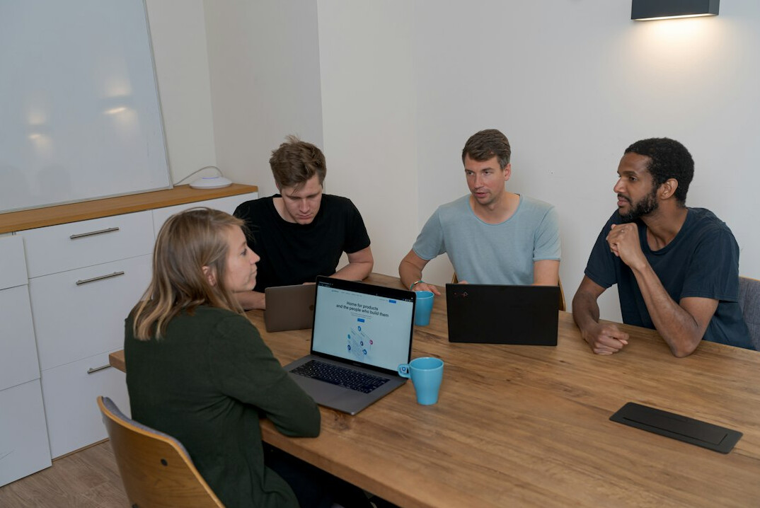 team of developers discussing insurance project